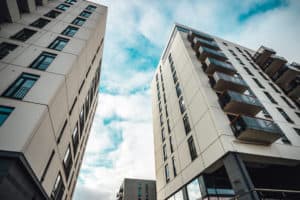 low-angle-shot-skyscrapers-modern-apartment-buildings